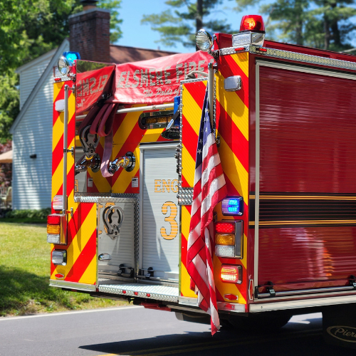 Fire Truck with our American flag hanging off the back of it